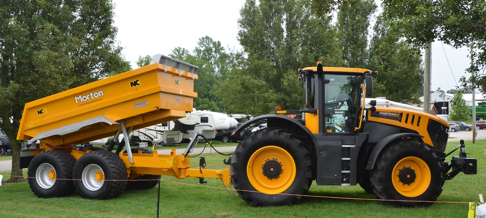 A tractor is pulling a trailer.